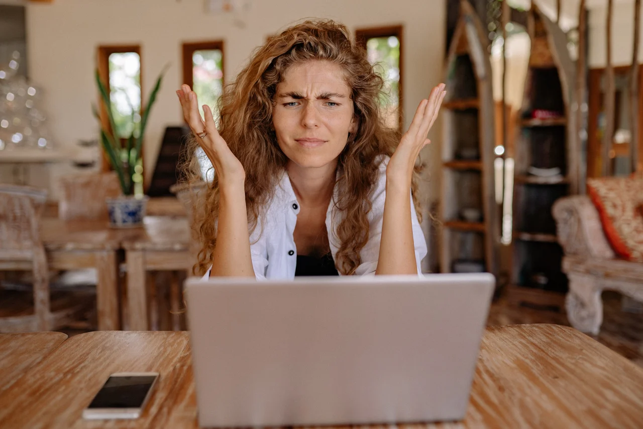 girl realised she made a mistake looking at laptop